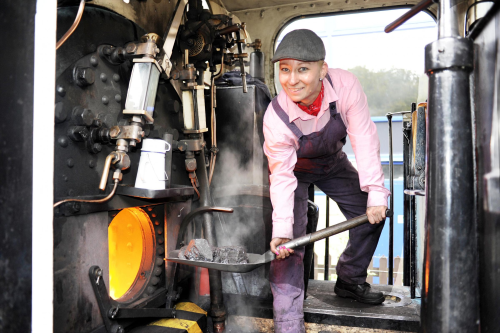 Bookkeeping locomotive fireman shovels coal